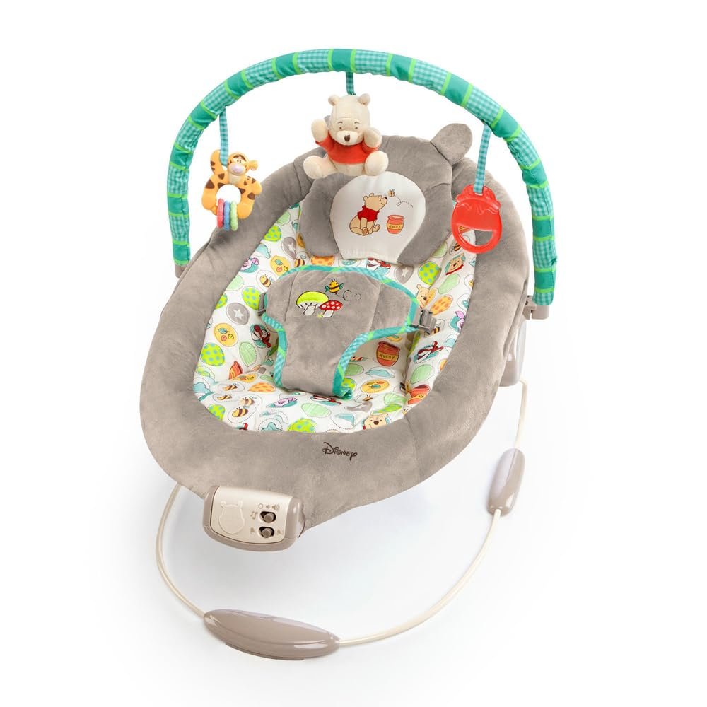 Bright Starts Disney Baby Winnie The Pooh Baby Bouncer Soothing Vibrations Deluxe Infant Seat – Faux Suede, Music, Removable -Toy Bar, 0-6 Months 6-20 lbs (Dots & Hunny Pots)